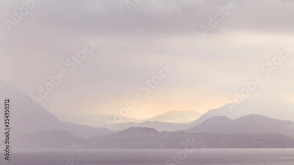 Obraz sunset over a lake with rain