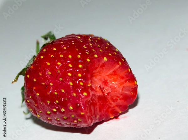 Obraz Bitten ripe strawberry close-up