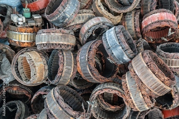 Fototapeta scrap yard of stator plate and wingdings in ac alternators for recycling. copper recycling from stator.