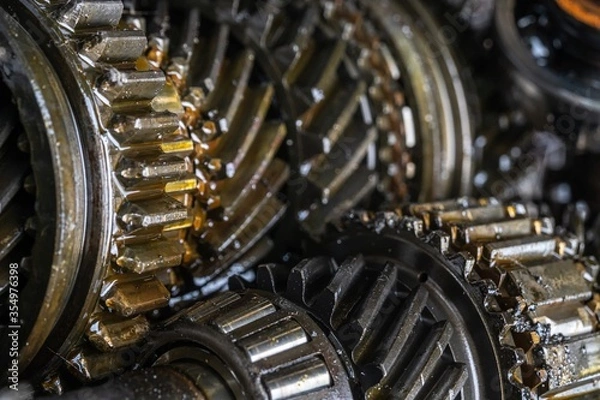 Fototapeta used transmission gearbox part at junkyard or scrapyard for recycling with selective fucus