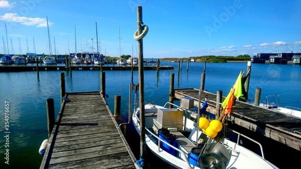 Obraz Boats drop at  the harbor in summer time no people with blue sky and sea background