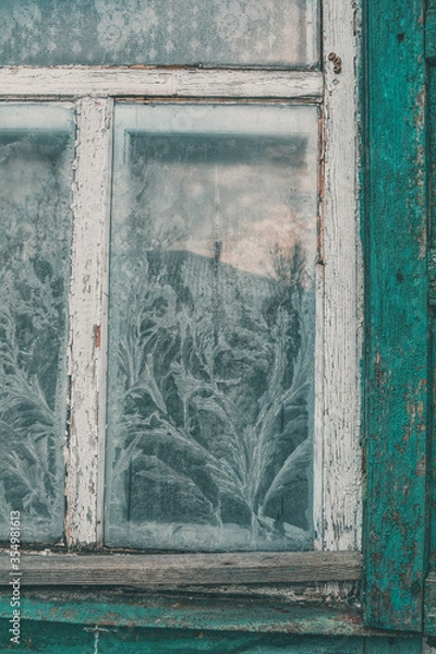 Obraz frosty pattern on an old window