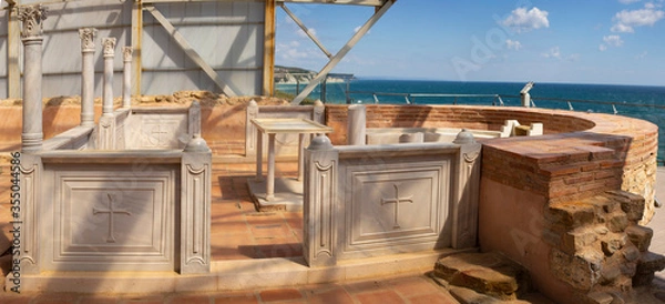 Fototapeta The altar part of the old Byzantine chapel. The baptistery is located in the narthex of a 5th-century Basilica in an ancient fortress in Byala (Bulgaria).