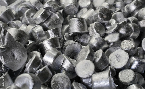 Obraz Lots of shiny aluminum ingots at a recycling plant