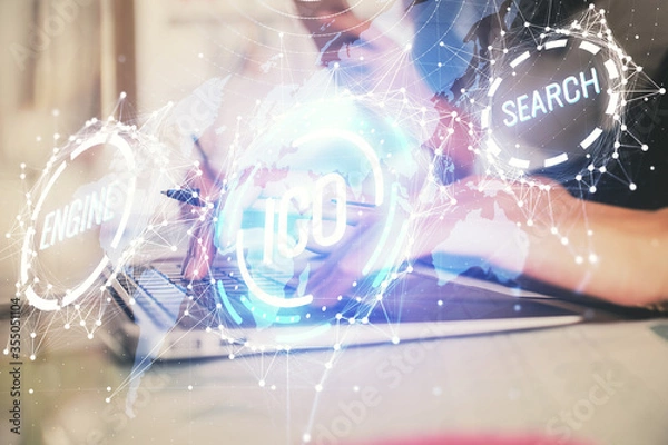 Fototapeta Double exposure of woman hands typing on computer and crypto market theme hologram drawing. Blockchain concept.