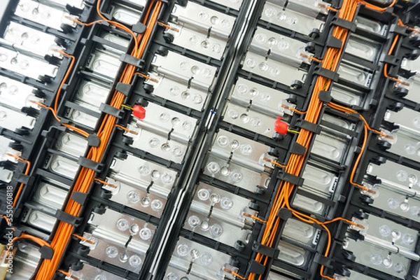 Fototapeta  Selective focus of Electric car lithium battery pack and wiring connections internal between cells on background.