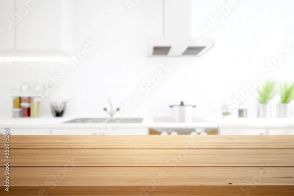 Obraz Wood table top on blur kitchen counter background.
