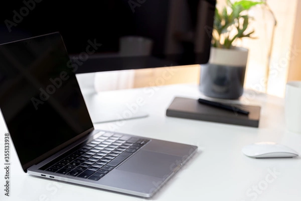 Fototapeta Working creative workspace with computer laptop with coffee cup and notebook, Clean workplace with desktop computer, workspace work from home