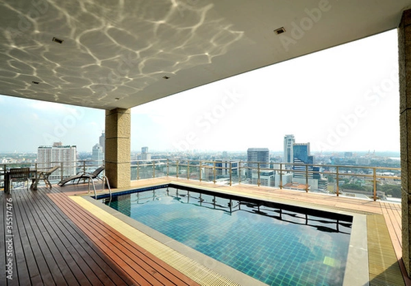 Obraz Widok na miasto i odbicie na basenie na dachu