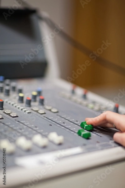 Obraz Portrait of a hand setting the sound