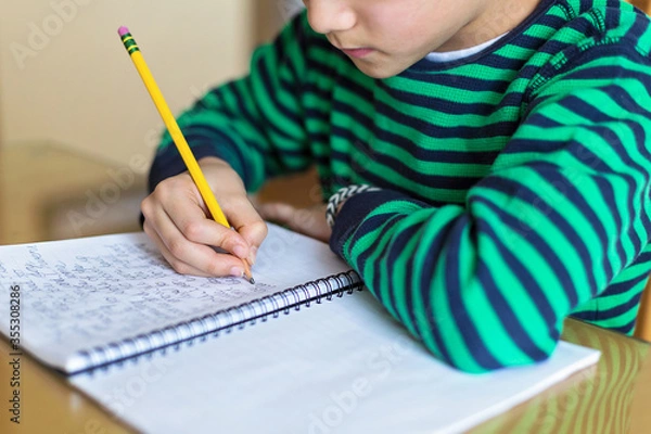 Obraz child writing cursive