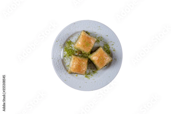 Fototapeta Pistachio baklava.  Traditional Dessert Baklava with pistachio. top view white background isolated