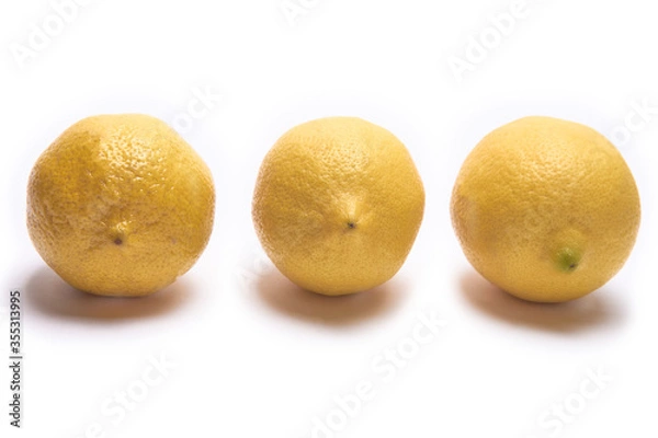 Obraz Three lemons on a white background