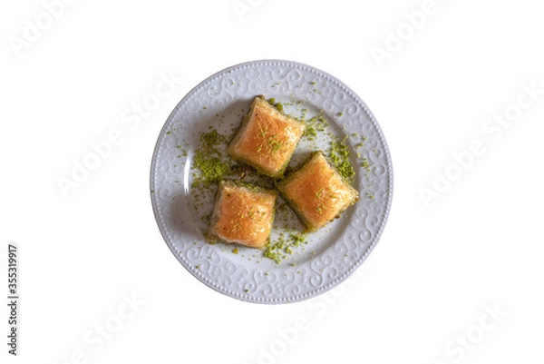 Fototapeta Pistachio baklava.  Traditional Dessert Baklava with pistachio. top view white background isolated