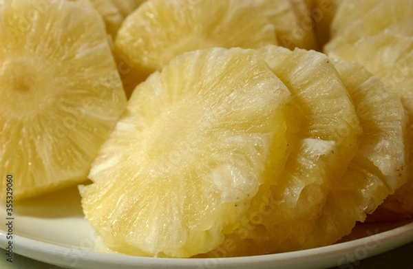 Fototapeta Pineapple. Juice and cut fruit set on the table.