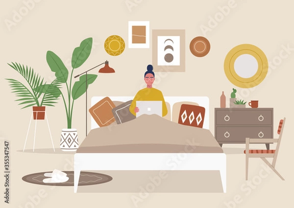 Fototapeta Cozy boho bedroom interior, young female character lying in bed with a laptop, flat editable vector illustration