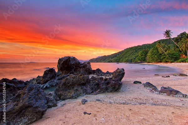 Fototapeta Beautiful nature view during sunset moment. Soft focus to the water movement due to long exposure technique