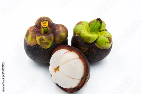 Obraz Three mangosteen placed on a white ground.