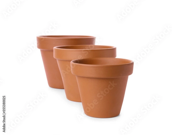 Fototapeta Stylish terracotta flower pots isolated on white