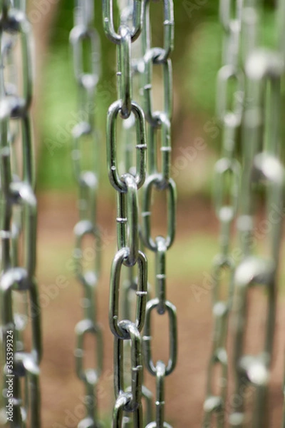 Obraz Metal chains are hanging. Abstract image, may be used as background.