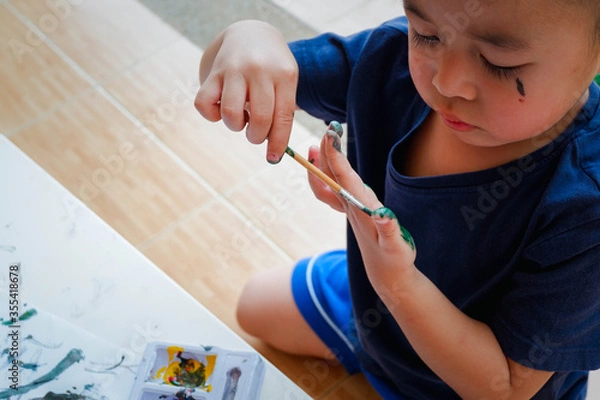 Obraz Funny little boy with painted hand