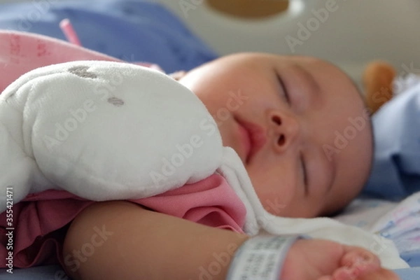 Obraz The sick boy was sleeping in a hospital bed. Boy is sick with Respiratory Syncytial Virus.