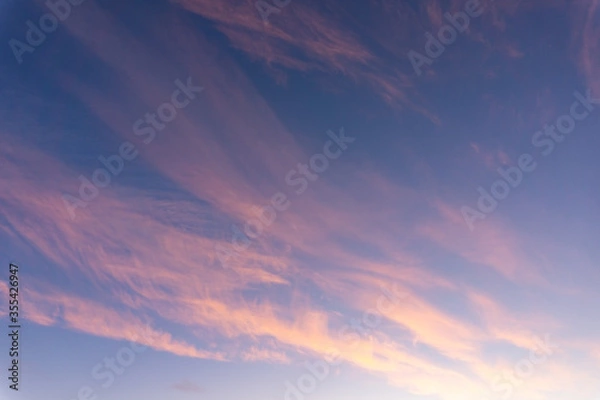 Obraz Blue sky with clouds in pink light
