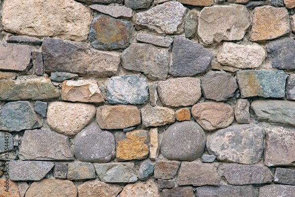 Fototapeta The masonry of the ancient wall consists of regular-shaped stone blocks