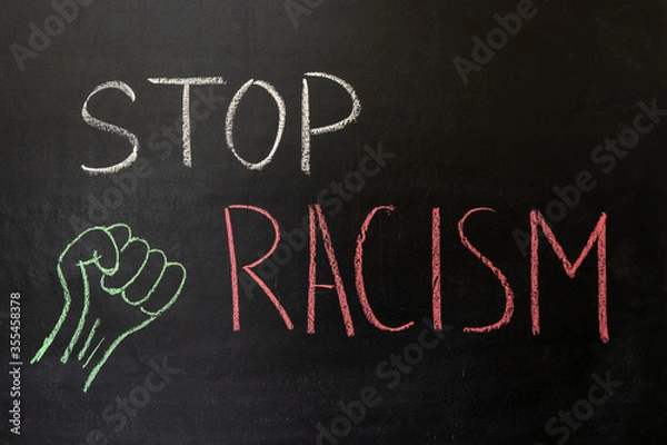 Obraz Text STOP RACISM on a chalkboard, drawing a fist