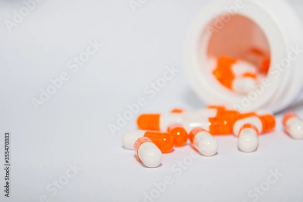Fototapeta Tablets. Orange capsules.