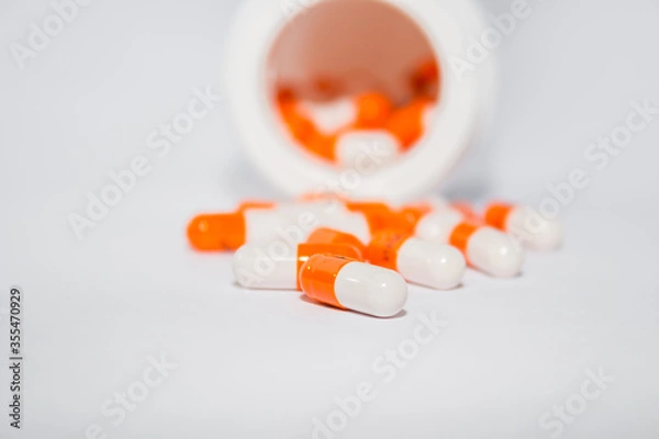 Fototapeta Tablets. Orange capsules.