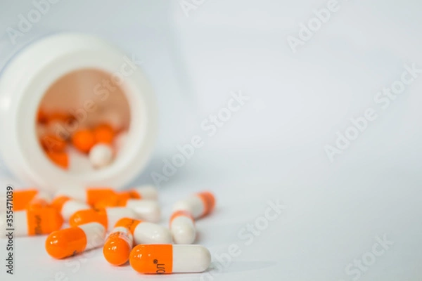 Fototapeta Tablets. Orange capsules.