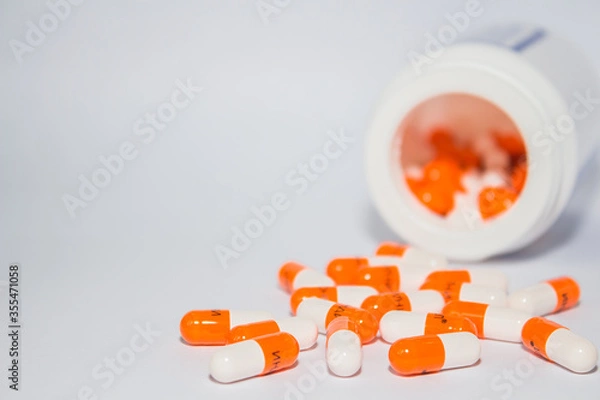 Fototapeta Tablets. Orange capsules.