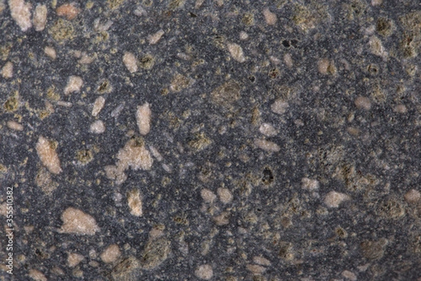 Fototapeta The texture of a granite stone, close-up. Background.