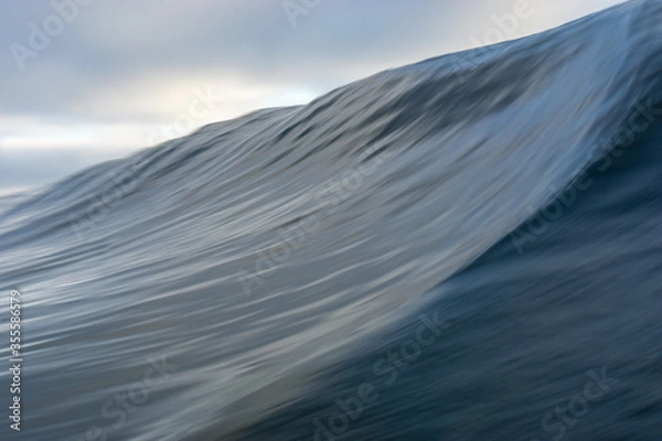 Obraz Abstract Atlantic ocean wave - slow shutter speed - blue blurred waves in the ocean