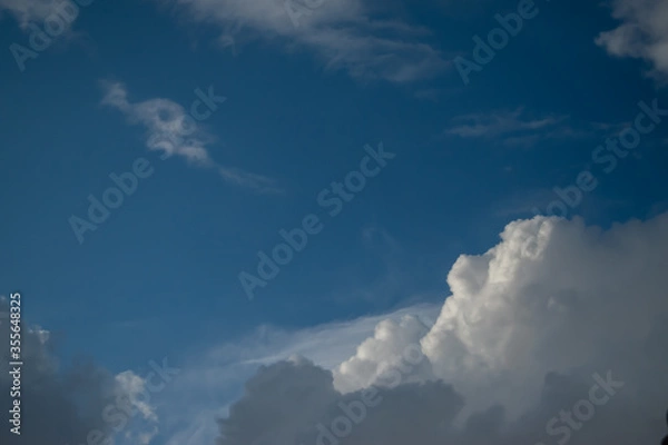 Obraz blue sky with clouds like a human face landscape