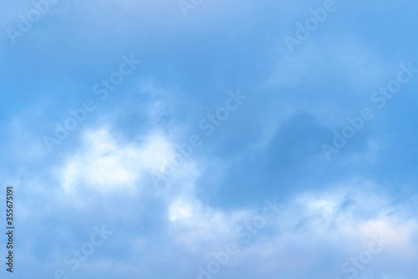Fototapeta blue sky with white, soft clouds. Nature background.