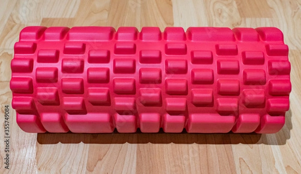 Fototapeta Red foam roller with bumpy knobs