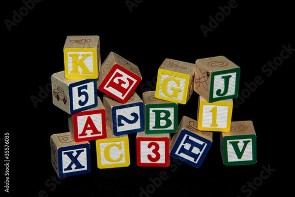 Obraz Pile of Alphabet Blocks over Black