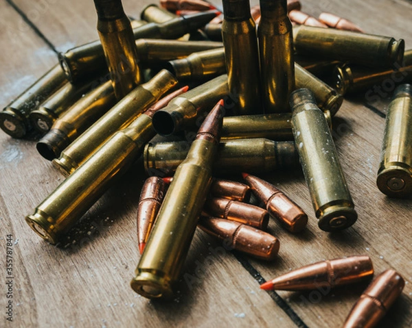Obraz .308 Ammunition with projectiles Flat Lay on board surrounded by powder