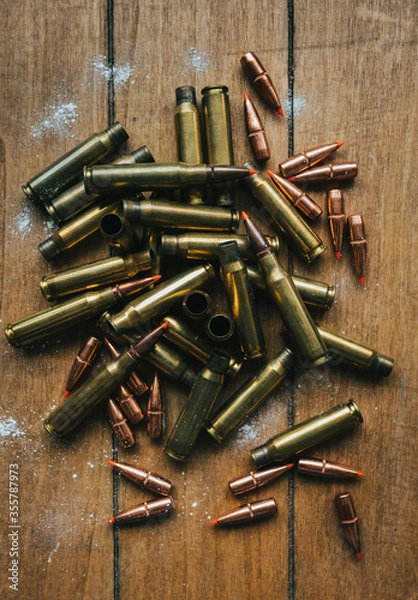Obraz .308 Ammunition with projectiles Flat Lay on board surrounded by powder