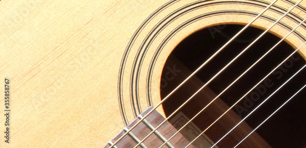 Fototapeta Classical guitar closeup - includes strings and guitar neck