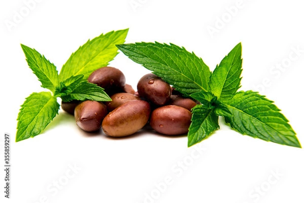 Obraz Kalamata olives with mint leaves on a white background