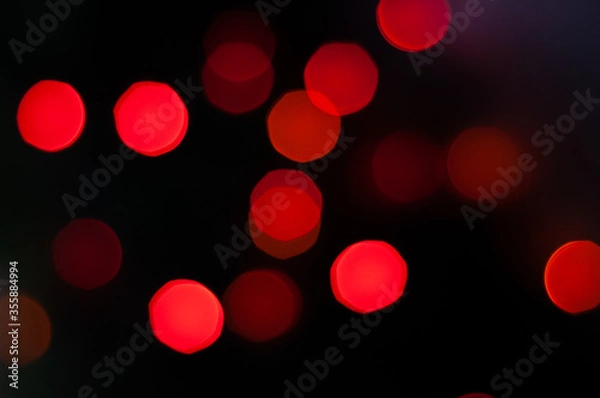 Fototapeta Red lights, blured bokeh background.