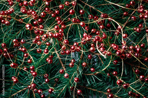 Fototapeta Christmas background with fir branches and red decorative balls. Design template for new year and christmas.
