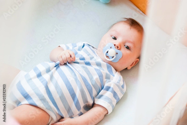 Obraz The kid in a bed