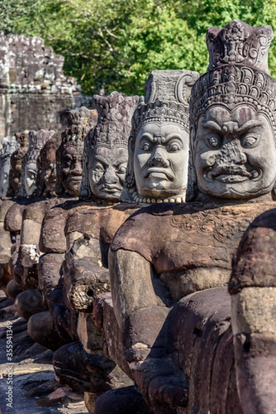 Fototapeta Stone Statue at the South Bayon Gate to Bayon Temple at the Angkor Wat Complex Near Siem Reap Cambodia