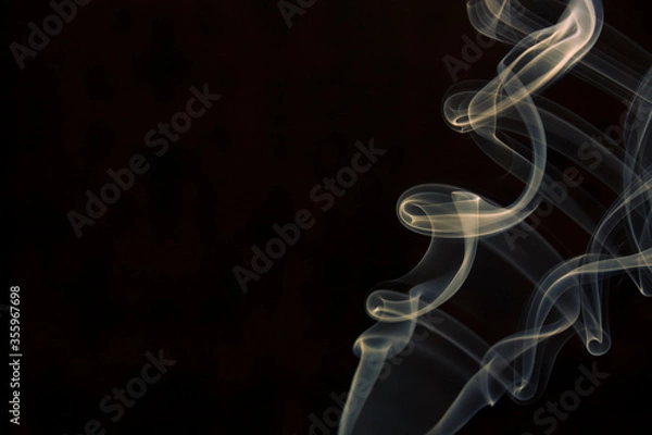 Obraz yellow smoke on black background