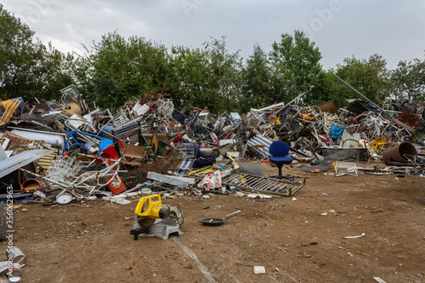 Fototapeta Sweden - August 17, 2011: One of the scrap yard (heap), junkyard, dump with a lot of different things
