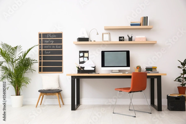 Fototapeta Modern computer on table in office interior. Stylish workplace